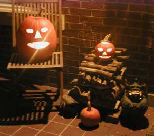 Still life with jack-o-lanterns and iron dog, light